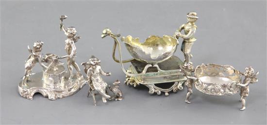 Four late 19th/early 20th century German silver miniature figural groups, largest length 75mm.